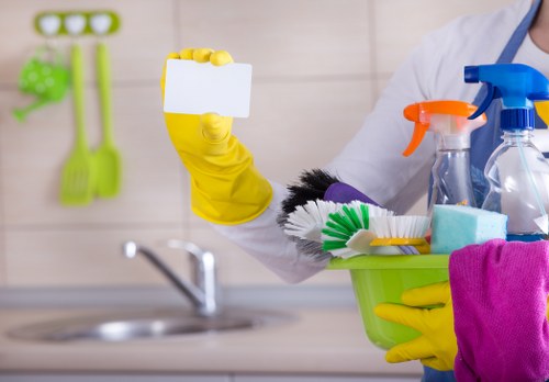 Post-build cleaning team removing dust from a Shepherdsbush renovation